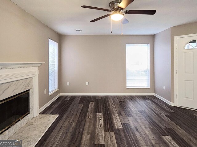 6401 Wedgeview Ct Unit 6401, Tucker, GA 30084 - unfurnished living room with visible vents, baseboards, a ceiling fan, a fireplace, and dark wood-style floors