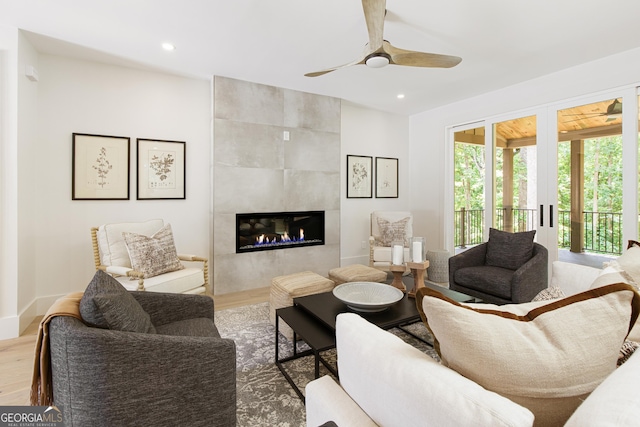 5535 Chestatee Landing Way, Gainesville, GA 30506 - living area featuring wood finished floors, ceiling fan, a tile fireplace, and recessed lighting