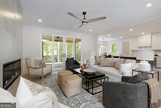 5535 Chestatee Landing Way, Gainesville, GA 30506 - living room featuring a ceiling fan, recessed lighting, a fireplace, and wood finished floors