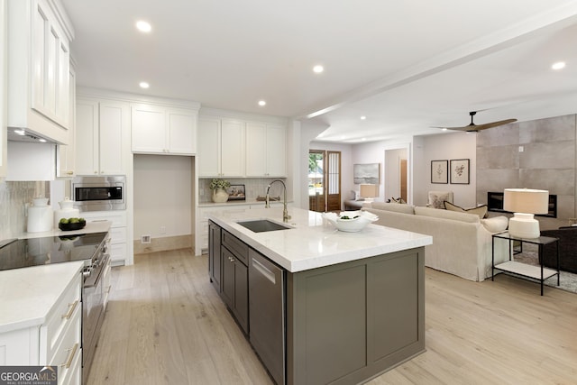 5535 Chestatee Landing Way, Gainesville, GA 30506 - kitchen featuring a sink, stainless steel appliances, white cabinets, light wood-style floors, and recessed lighting