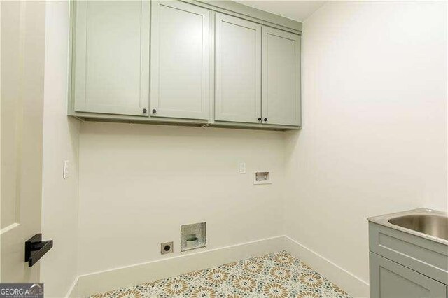 5535 Chestatee Landing Way, Gainesville, GA 30506 - washroom with washer hookup, electric dryer hookup, cabinet space, baseboards, and tile patterned floors
