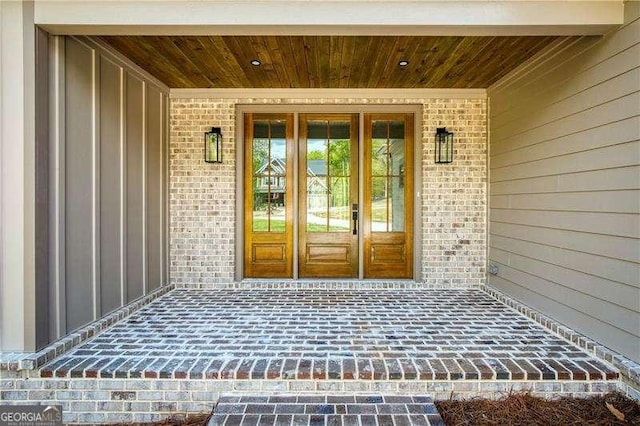 5535 Chestatee Landing Way, Gainesville, GA 30506 - entrance to property with brick siding, board and batten siding, and french doors