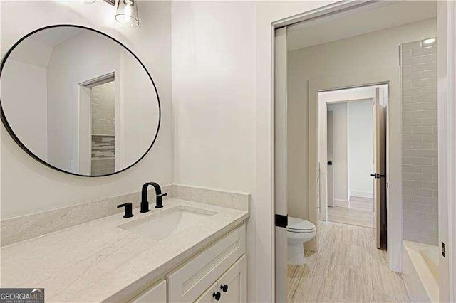 5535 Chestatee Landing Way, Gainesville, GA 30506 - bathroom featuring vanity, toilet, and a tub