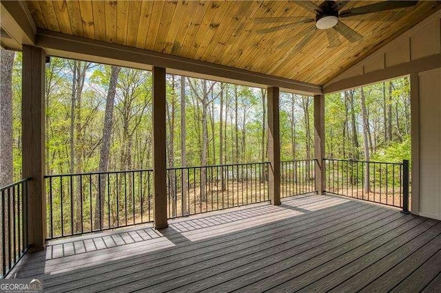 5535 Chestatee Landing Way, Gainesville, GA 30506 - unfurnished sunroom featuring a ceiling fan, a forest view, healthy amount of natural light, and vaulted ceiling