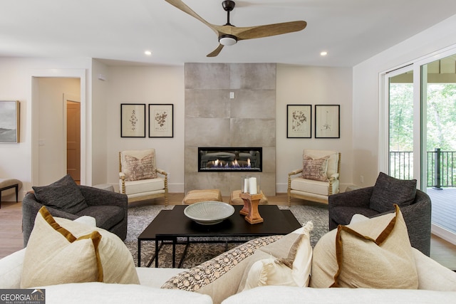 5535 Chestatee Landing Way, Gainesville, GA 30506 - living area with wood finished floors, healthy amount of natural light, a tiled fireplace, ceiling fan, and recessed lighting