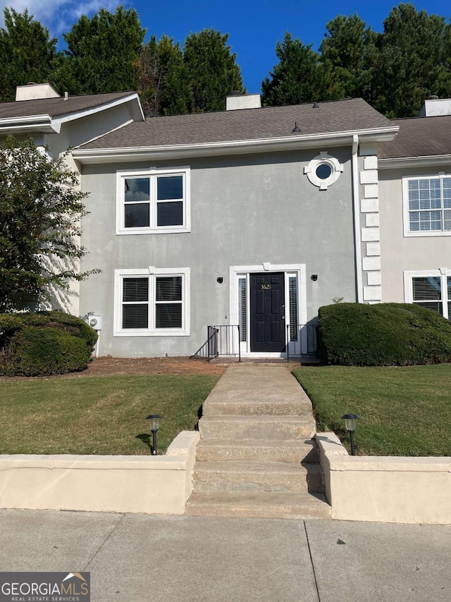 3621 Stedman Pl, Duluth, GA 30096 - view of front of property featuring a front yard, stucco siding, and a shingled roof