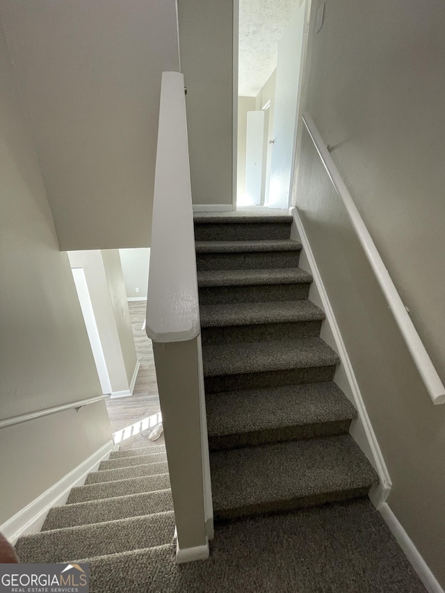 3621 Stedman Pl, Duluth, GA 30096 - stairway featuring baseboards and carpet flooring