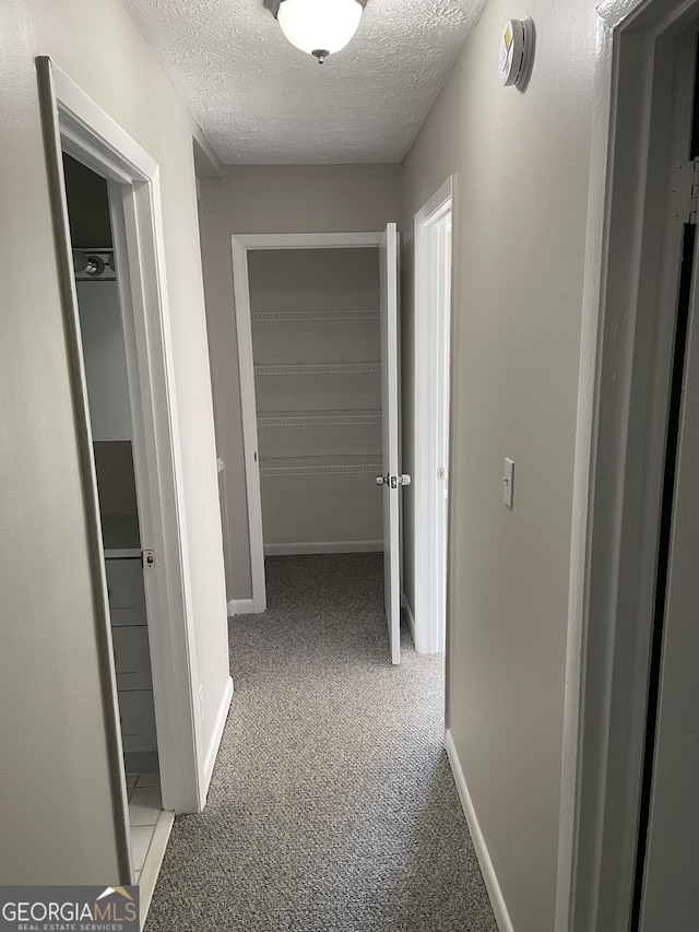 3621 Stedman Pl, Duluth, GA 30096 - corridor featuring a textured ceiling and carpet flooring