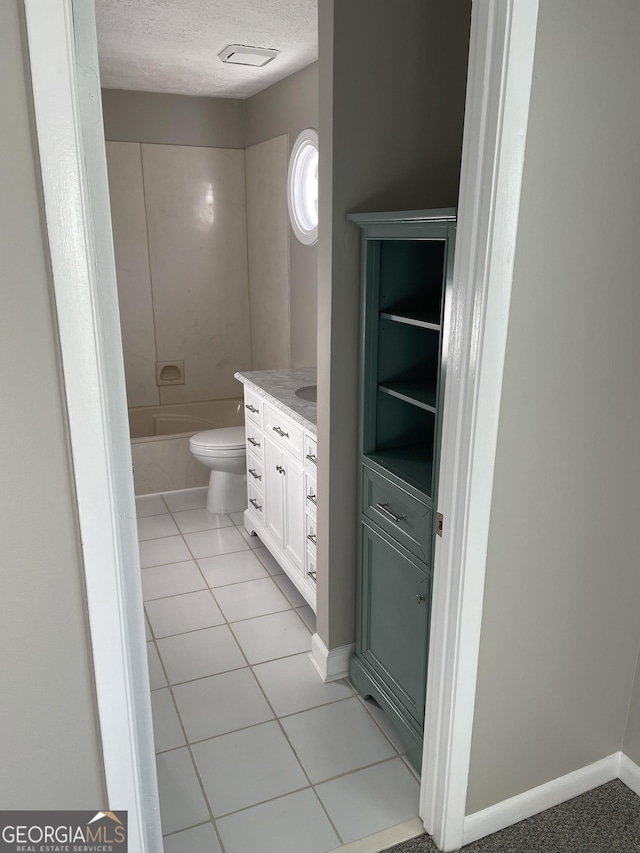 3621 Stedman Pl, Duluth, GA 30096 - bathroom with vanity, a textured ceiling, a tub to relax in, and tile patterned flooring