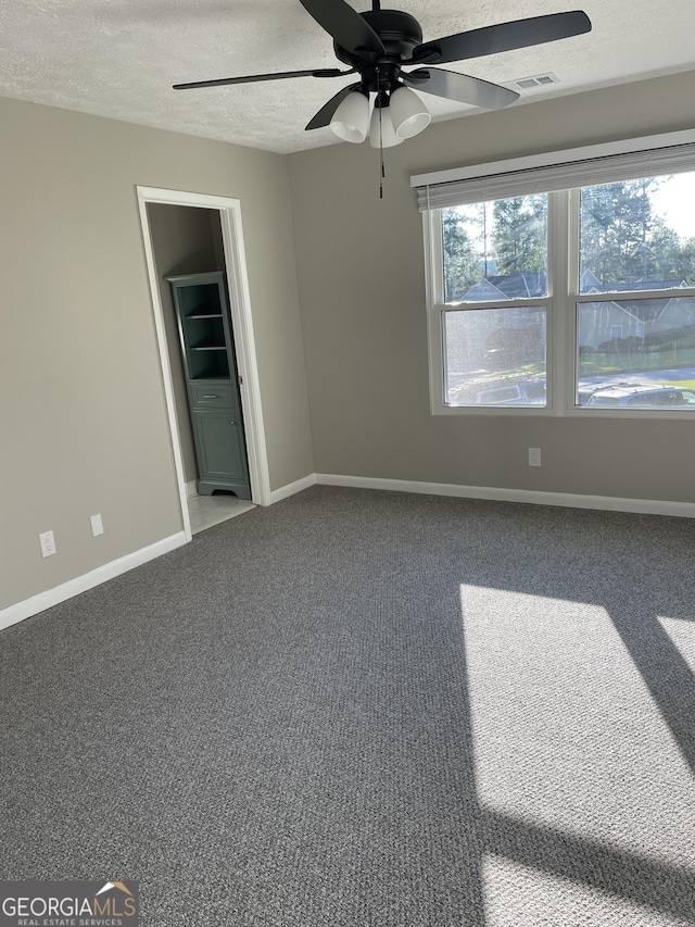 3621 Stedman Pl, Duluth, GA 30096 - spare room featuring a ceiling fan, a textured ceiling, and carpet floors