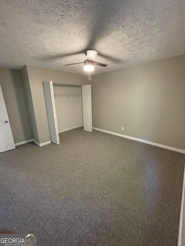 3621 Stedman Pl, Duluth, GA 30096 - unfurnished bedroom with carpet floors, a ceiling fan, a closet, and a textured ceiling