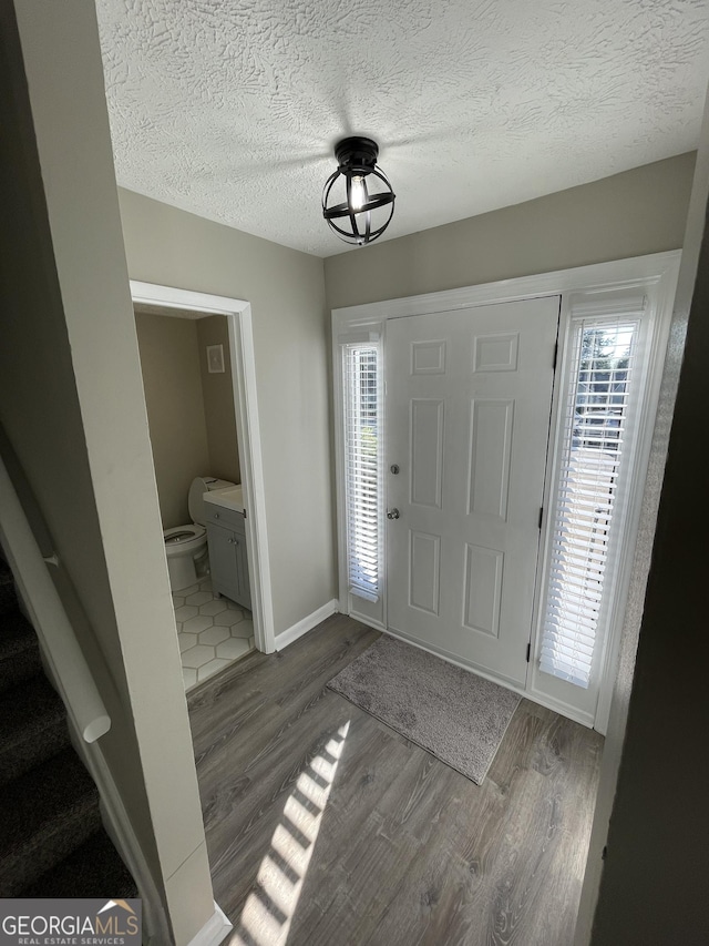 3621 Stedman Pl, Duluth, GA 30096 - entryway featuring plenty of natural light, wood finished floors, stairs, and a textured ceiling