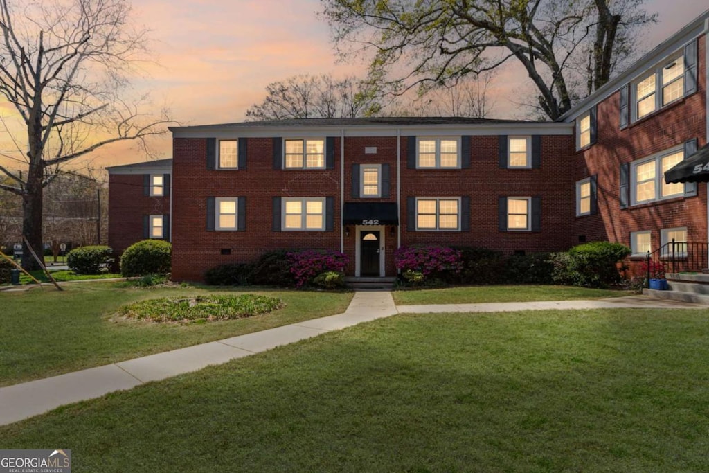 542 Goldsboro Rd NE Unit C, Atlanta, GA 30307 - view of front facade with a front yard and brick siding