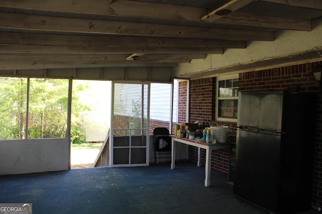 miscellaneous room with brick wall