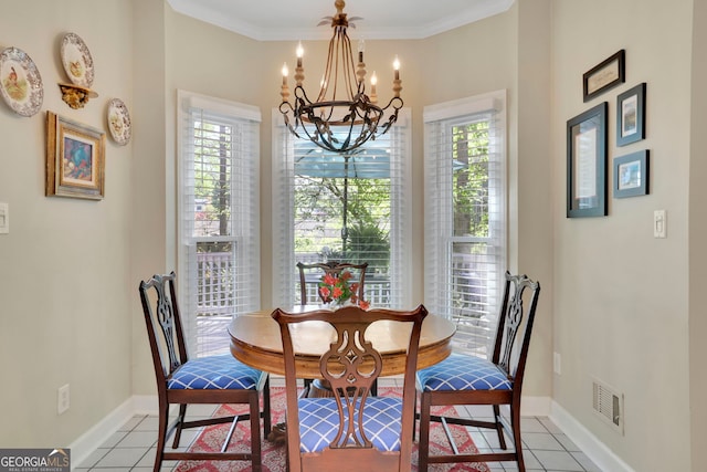 dining space with an inviting chandelier, baseboards, visible vents, and a wealth of natural light