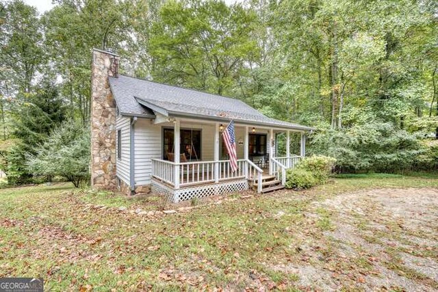 83 Smokey Creek Cv Tract B, Unit Tract B, Blairsville, GA 30512 - view of front facade featuring a porch and a chimney