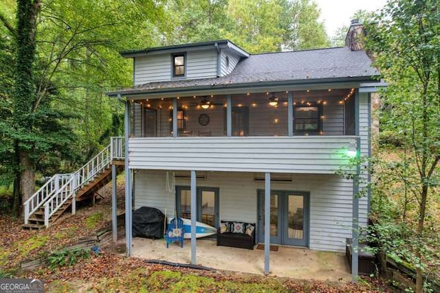 83 Smokey Creek Cv Tract B, Unit Tract B, Blairsville, GA 30512 - rear view of house featuring a chimney, a patio area, a sunroom, and stairs