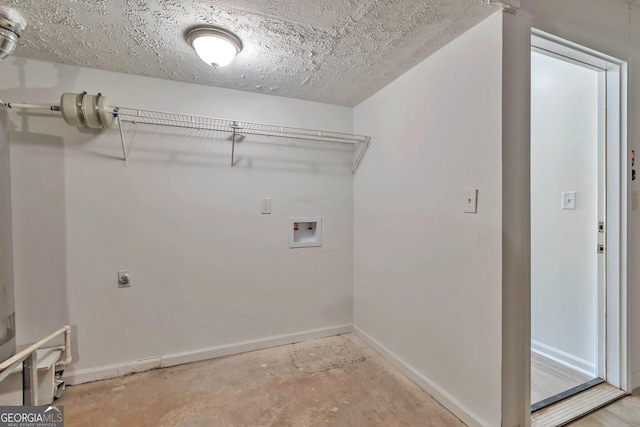 5350 Rockbridge Rd, Stone Mountain, GA 30088 - laundry room featuring laundry area, hookup for a washing machine, electric dryer hookup, a textured ceiling, and baseboards