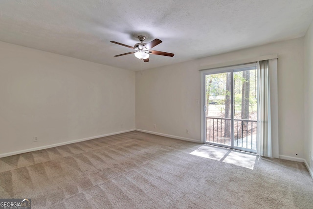 5350 Rockbridge Rd, Stone Mountain, GA 30088 - carpeted empty room with baseboards, a textured ceiling, and ceiling fan