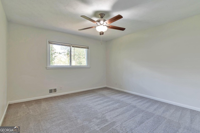 5350 Rockbridge Rd, Stone Mountain, GA 30088 - unfurnished room featuring ceiling fan, baseboards, visible vents, and carpet floors