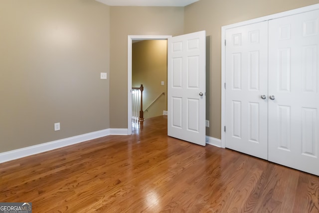 532 Zellner Rd, Forsyth, GA 31029 - unfurnished bedroom with wood finished floors, a closet, and baseboards