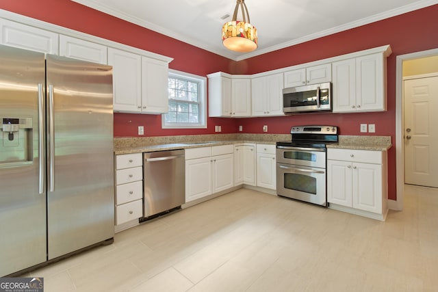 532 Zellner Rd, Forsyth, GA 31029 - kitchen featuring stainless steel appliances, white cabinetry, pendant lighting, ornamental molding, and light stone counters