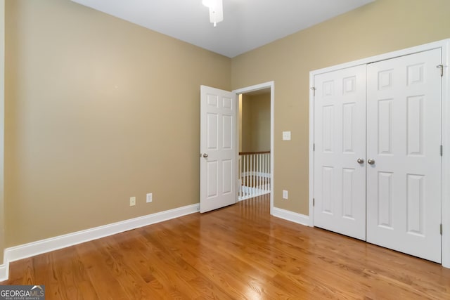 532 Zellner Rd, Forsyth, GA 31029 - unfurnished bedroom featuring light wood-style floors, baseboards, and a closet
