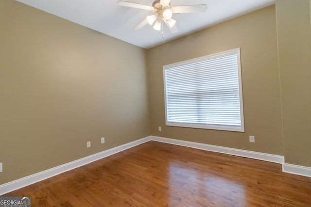 532 Zellner Rd, Forsyth, GA 31029 - empty room with a ceiling fan, wood finished floors, and baseboards