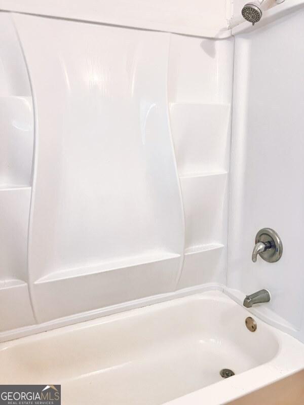 full bathroom with shower / tub combination
