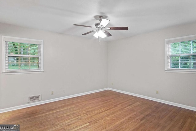 2732 Elkhorn Dr, Decatur, GA 30034 - spare room featuring baseboards, visible vents, wood finished floors, and a ceiling fan