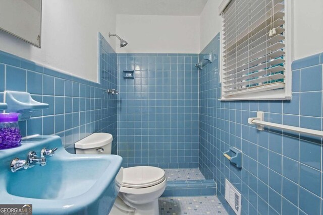 2732 Elkhorn Dr, Decatur, GA 30034 - full bathroom with a stall shower, tile walls, a sink, and visible vents