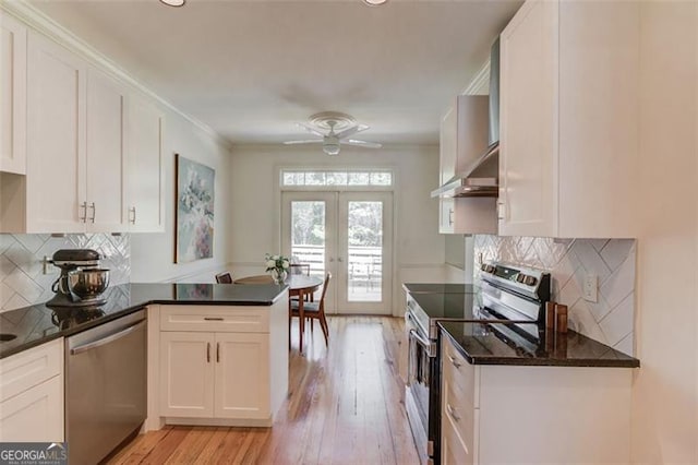 1038 Huntcliff, Atlanta, GA 30350 - kitchen featuring white cabinets, a peninsula, and appliances with stainless steel finishes