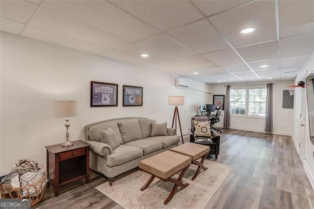 1038 Huntcliff, Atlanta, GA 30350 - living area with baseboards, recessed lighting, a paneled ceiling, and wood finished floors