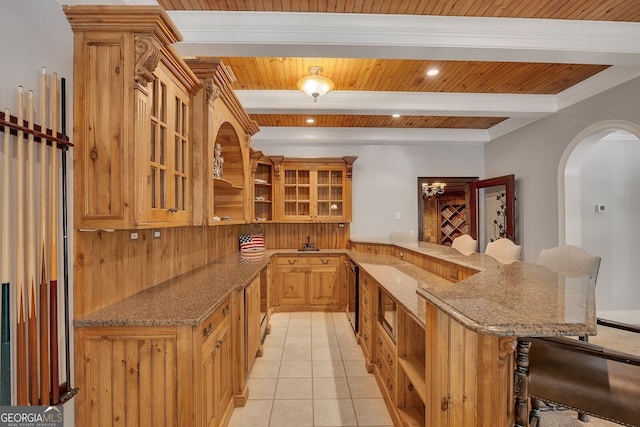 kitchen featuring a peninsula, a breakfast bar, open shelves, and beam ceiling