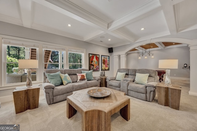 living room featuring light carpet, ornate columns, beam ceiling, coffered ceiling, and arched walkways