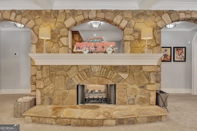 room details with baseboards, arched walkways, a stone fireplace, crown molding, and carpet floors