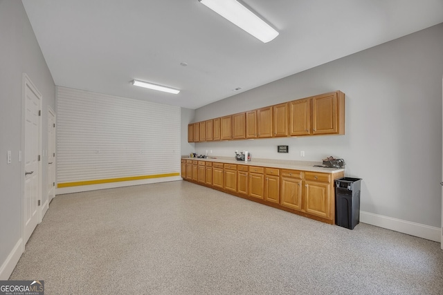kitchen with light countertops and baseboards