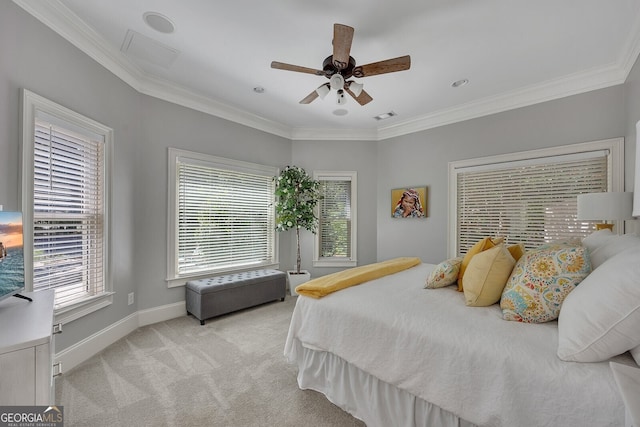 carpeted bedroom featuring visible vents, multiple windows, ornamental molding, and baseboards