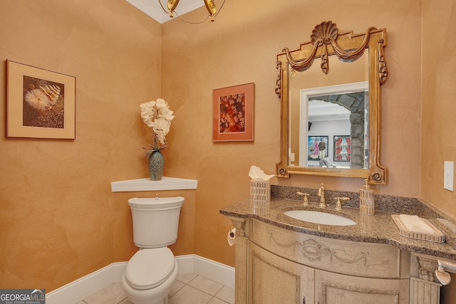 half bath featuring tile patterned floors, vanity, baseboards, and toilet