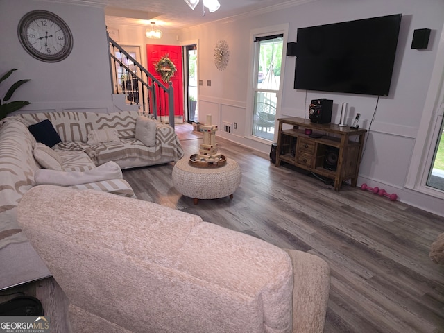 3650 Bay Leaf Dr, Loganville, GA 30052 - living area featuring ornamental molding, stairs, wood finished floors, a decorative wall, and plenty of natural light