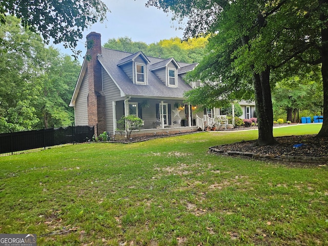 3650 Bay Leaf Dr, Loganville, GA 30052 - cape cod house featuring a chimney and covered porch