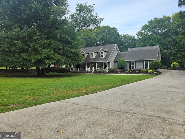 3650 Bay Leaf Dr, Loganville, GA 30052 - cape cod house with driveway, a front yard, and a porch