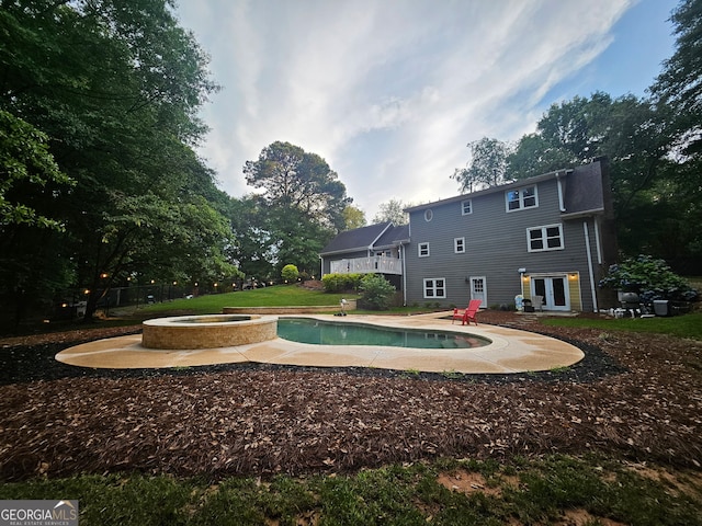 3650 Bay Leaf Dr, Loganville, GA 30052 - swimming pool featuring an in-ground hot tub, a patio, french doors, and a deck