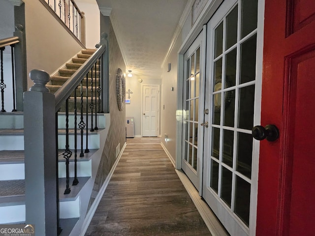 3650 Bay Leaf Dr, Loganville, GA 30052 - hall featuring crown molding, wood finished floors, stairs, and french doors
