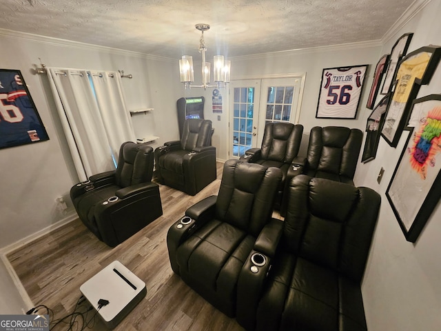 3650 Bay Leaf Dr, Loganville, GA 30052 - home theater with wood finished floors, a textured ceiling, a chandelier, and ornamental molding