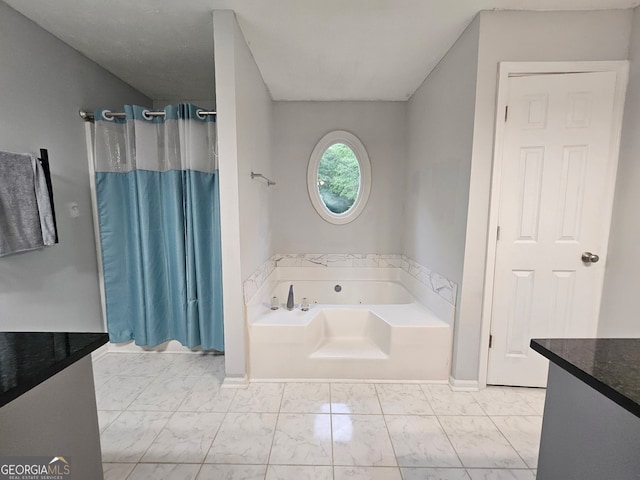 3650 Bay Leaf Dr, Loganville, GA 30052 - bathroom with marble look tiles, a jetted tub, vanity, and a shower with curtain
