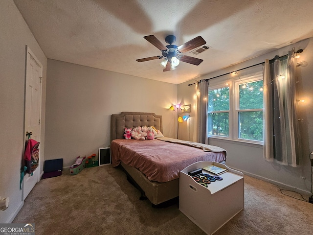 3650 Bay Leaf Dr, Loganville, GA 30052 - carpeted bedroom with a textured ceiling and a ceiling fan