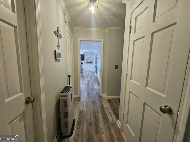 3650 Bay Leaf Dr, Loganville, GA 30052 - hallway with dark wood finished floors, ornamental molding, and a textured ceiling