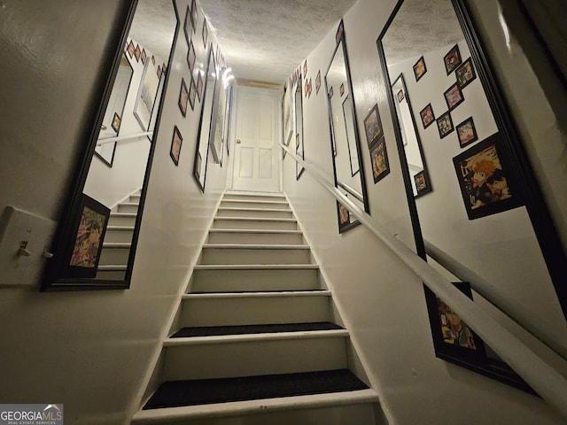 3650 Bay Leaf Dr, Loganville, GA 30052 - stairs with a textured ceiling
