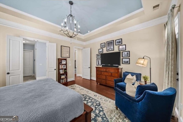 2358 New Salem Trce, Marietta, GA 30064 - bedroom with a chandelier, ornamental molding, wood finished floors, a raised ceiling, and baseboards